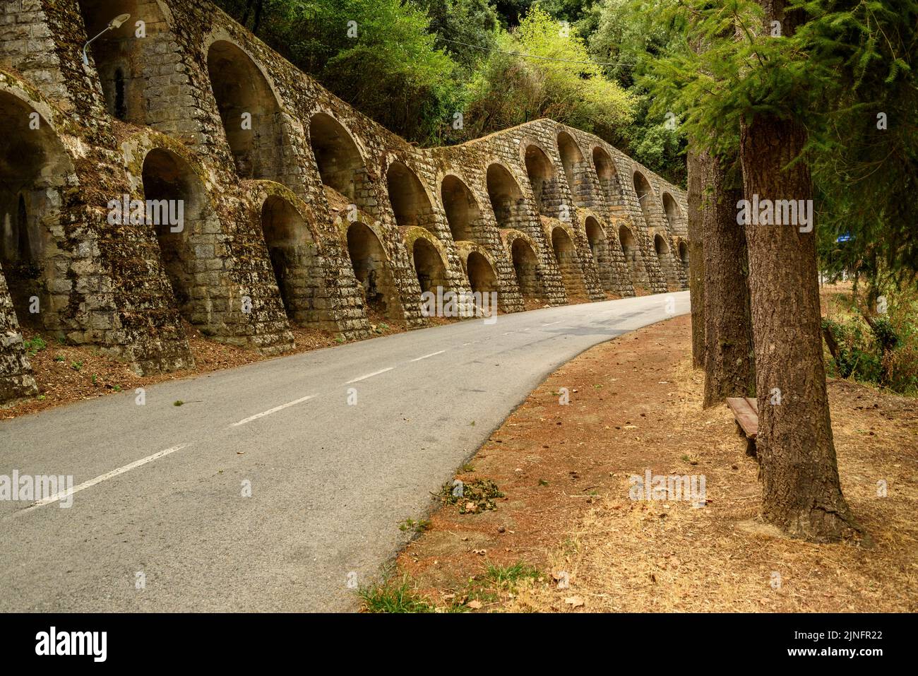 Reinforcement arches on the road leaving the village of Osor towards Sant Hilari Sacalm, in Les Guilleries mountains La Selva, Girona, Catalonia Spain Stock Photo