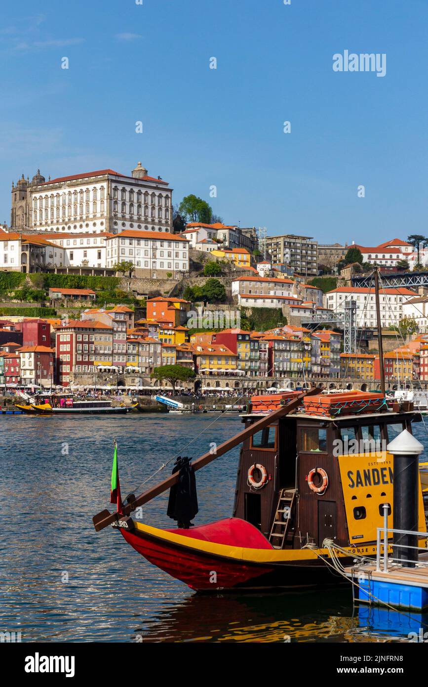 Traditional wooden port boat at Vila Nova de Gaia on the waterfront of the  River Douro in the centre of Porto a major city in northern Portugal. Stock Photo