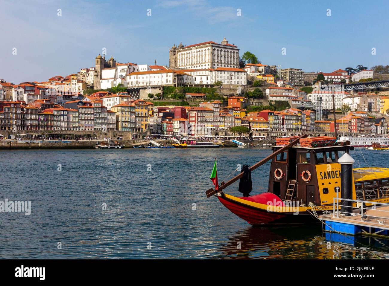 Traditional wooden port boat at Vila Nova de Gaia on the waterfront of the  River Douro in the centre of Porto a major city in northern Portugal. Stock Photo