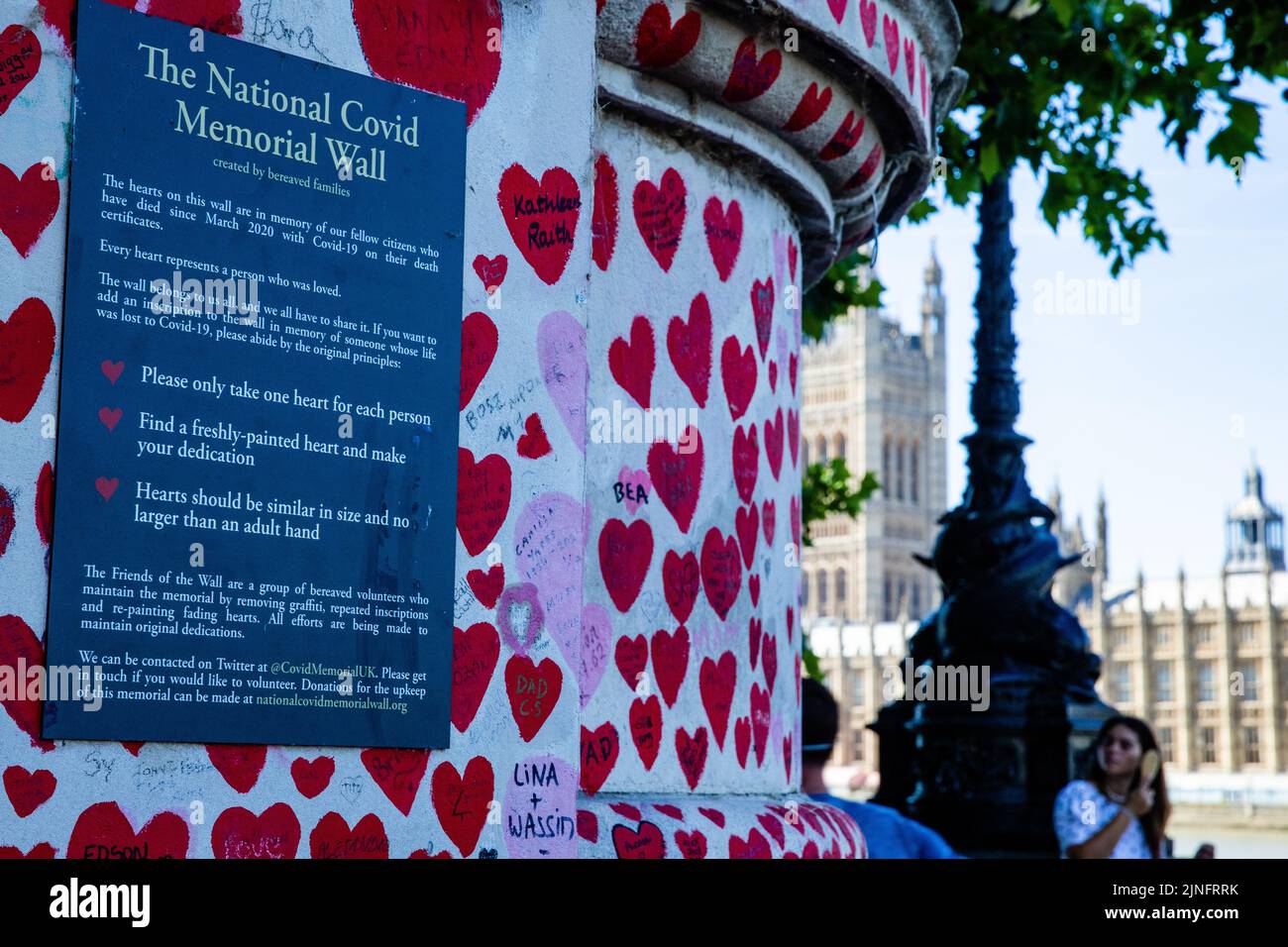 London, UK. 10th August, 2022. Members of the public pass in front of the National Covid Memorial Wall. The idea for the memorial wall came from Matt Stock Photo