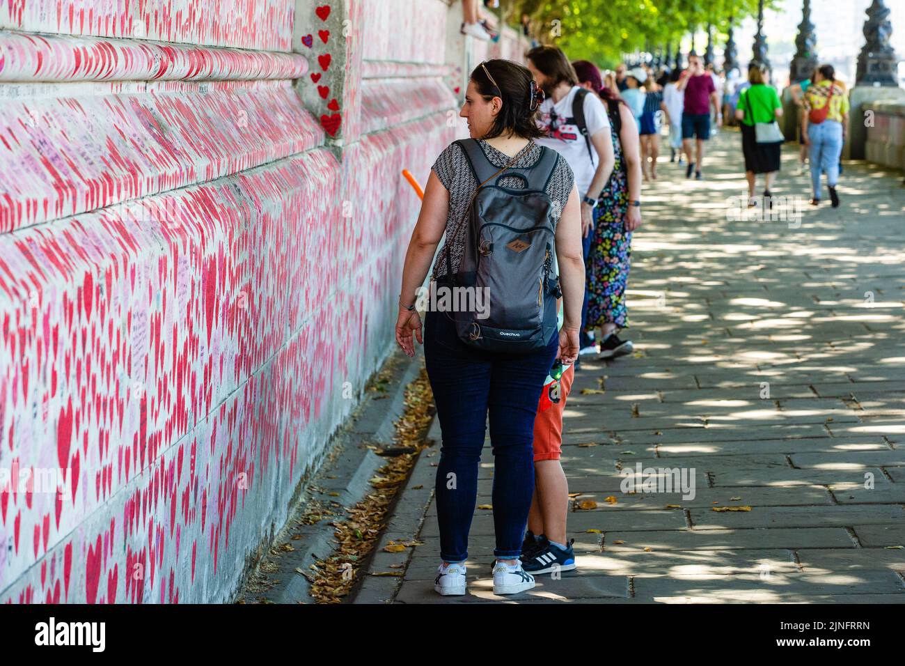 London, UK. 10th August, 2022. Members of the public look at the National Covid Memorial Wall. The idea for the memorial wall came from Matt Fowler an Stock Photo