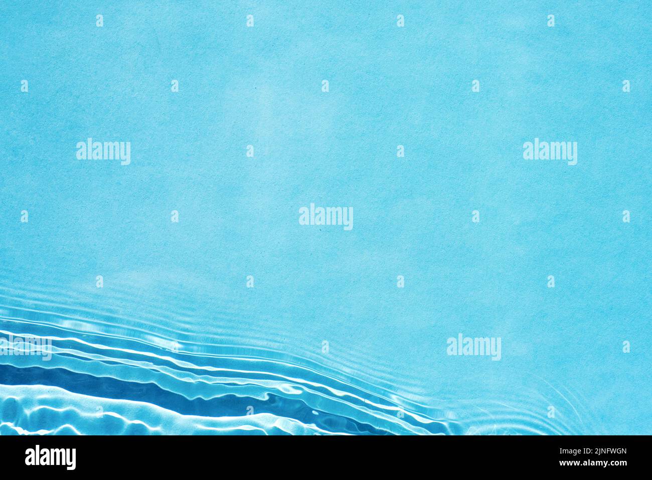 Water background. Blue water texture, blue surface with waves and ripples Stock Photo