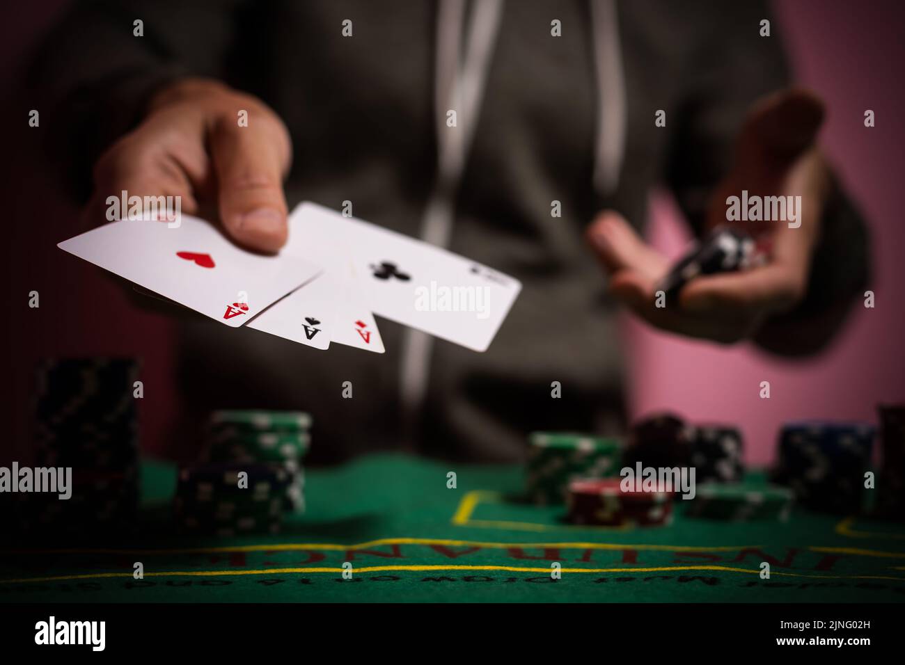 Devastated gambler man losing a lot of money playing poker in casino