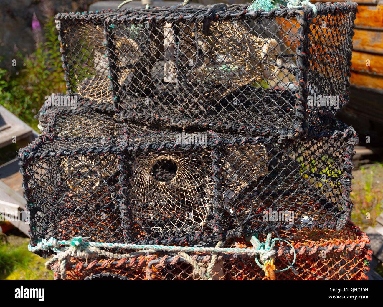 crab cage piled ready for usage Stock Photo Alamy