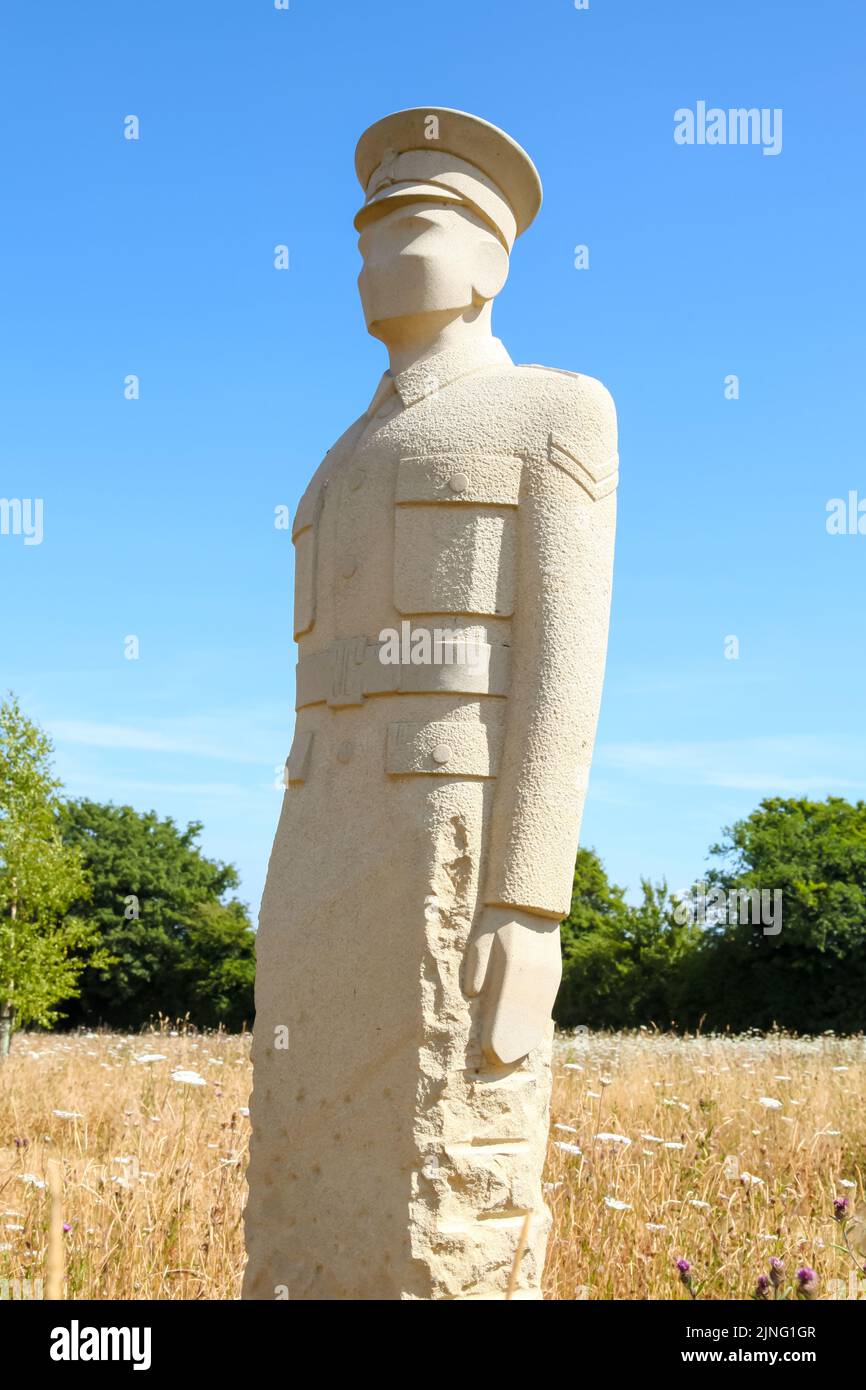Regiment of Trees, stone soldiers carved by Patrick Walls stand in a grid, Langley Vale