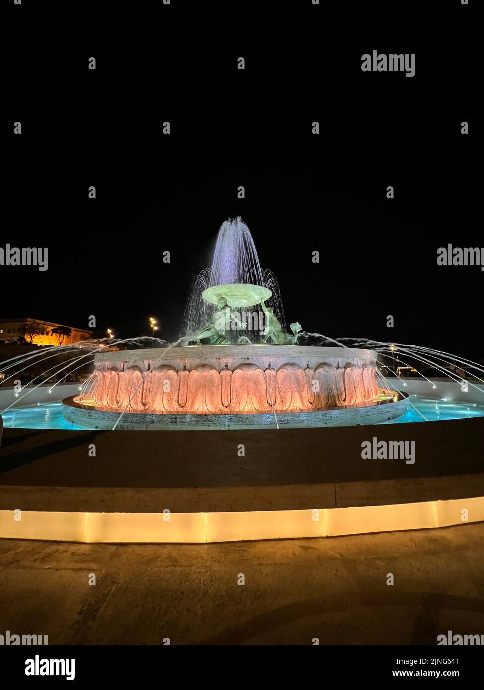 An illuminated water fountain at night Stock Photo - Alamy