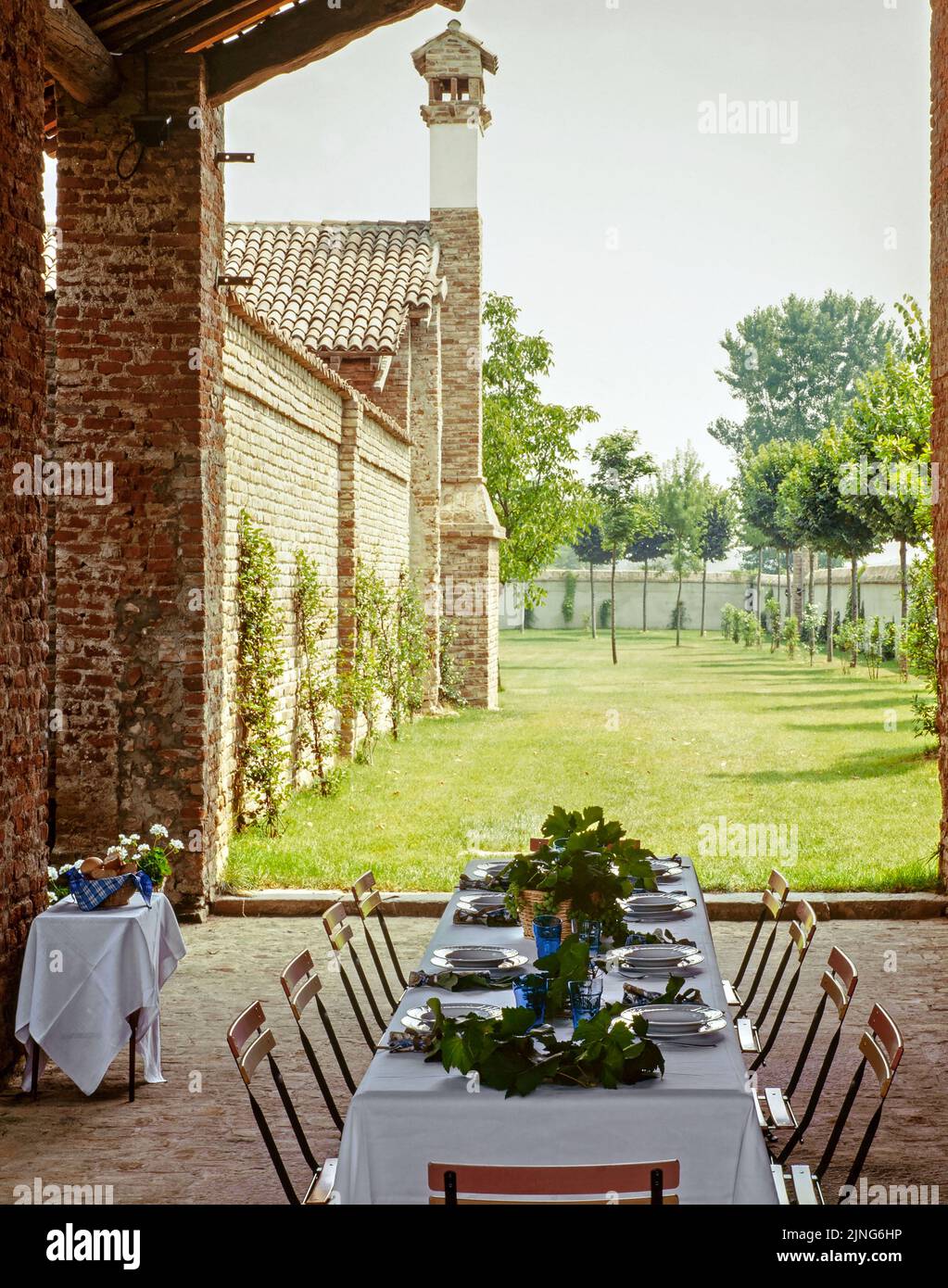 Rustic outdoor tables decorated with vine leaves Stock Photo Alamy