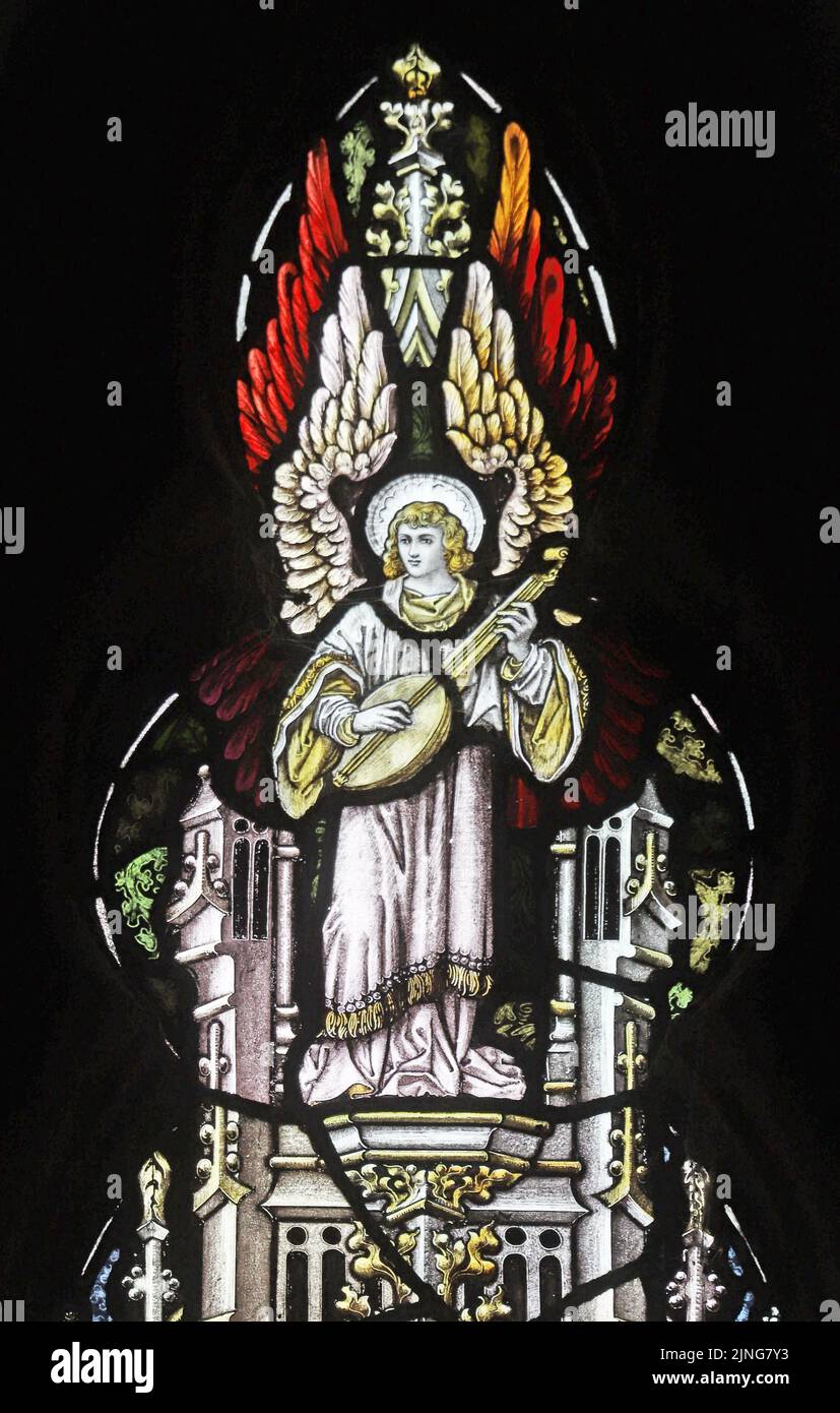 Detail of a stained glass window by Percy Bacon & Brothers depicting an angel playing a lute, Mawgan-in-Pyder, Cornwall Stock Photo