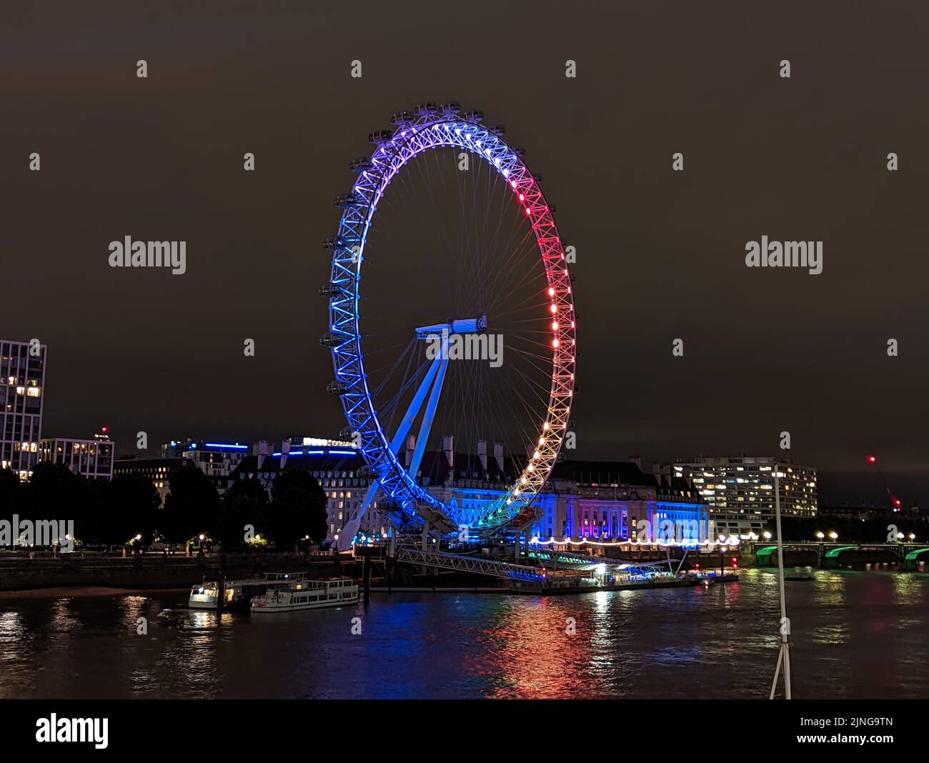 A London Eye ferris wheel in rainbow colors in support of London Pride, July 2nd 2022 Stock Photo