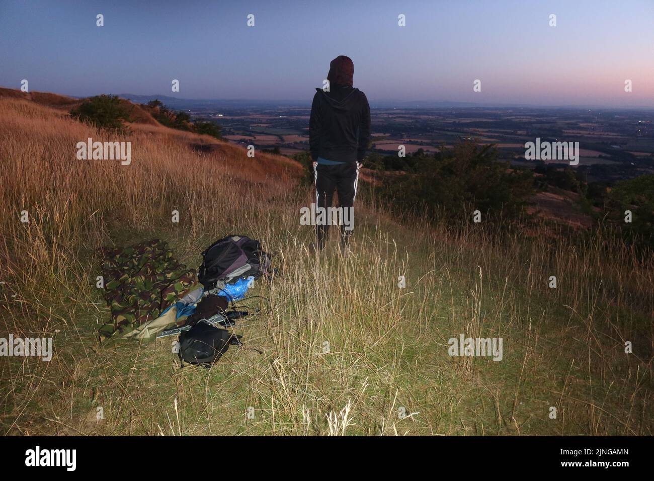 Solo wild camping in British army Gore-tex bivvy bag. Bredon Hill.  Worcestershire. England. UK. Stock Photo