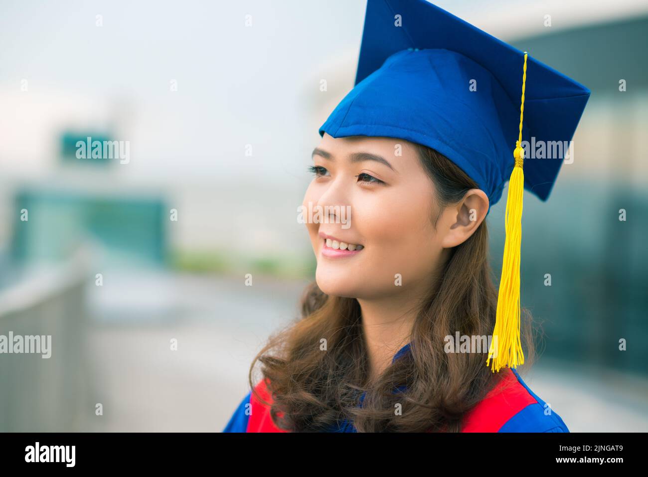 Portrait of proud pretty smiling Vietnamese graduate Stock Photo - Alamy