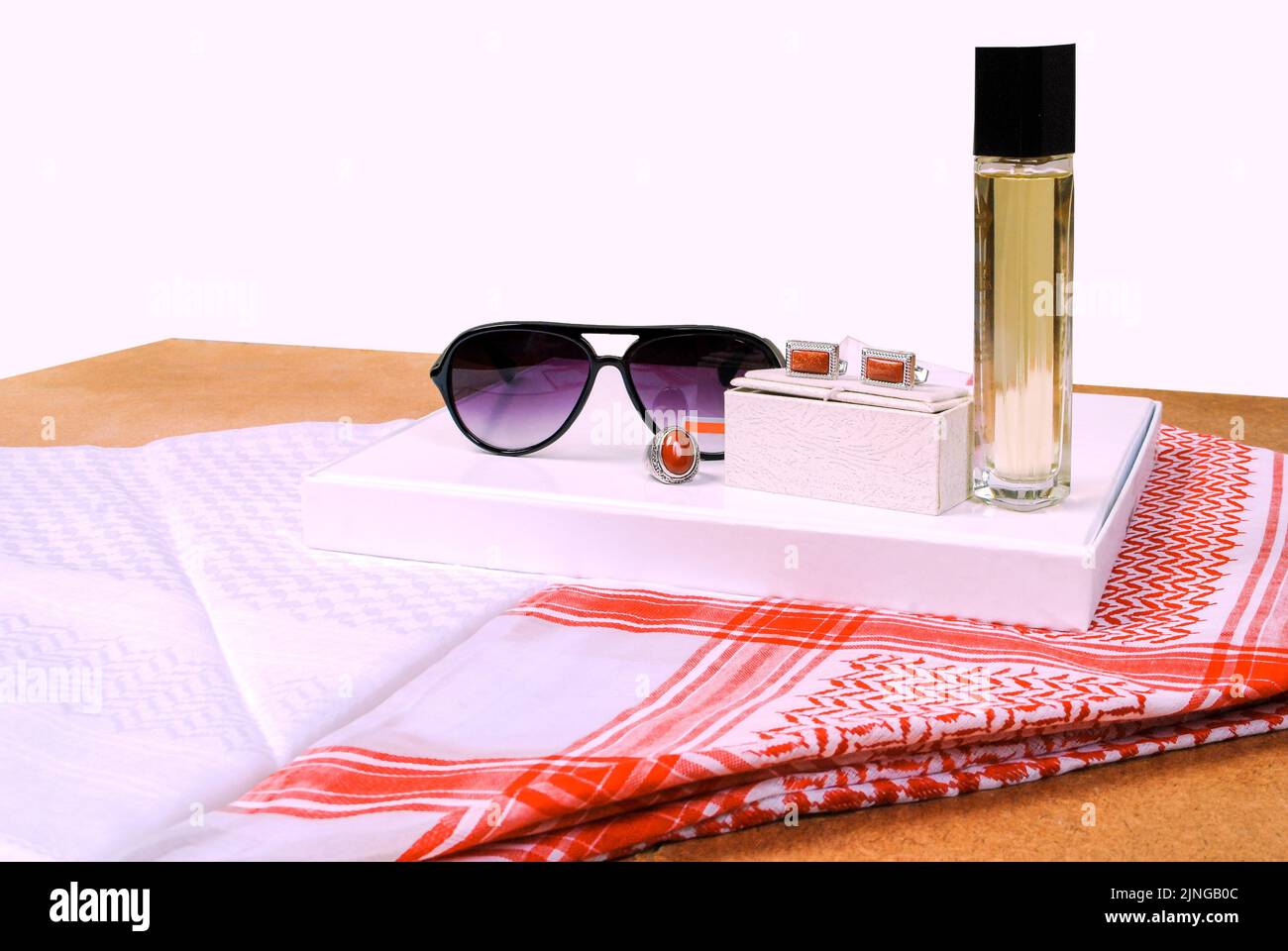 Saudi Arabian men wearing style accessories red white headscarf shemagh sunglasses perfume stone