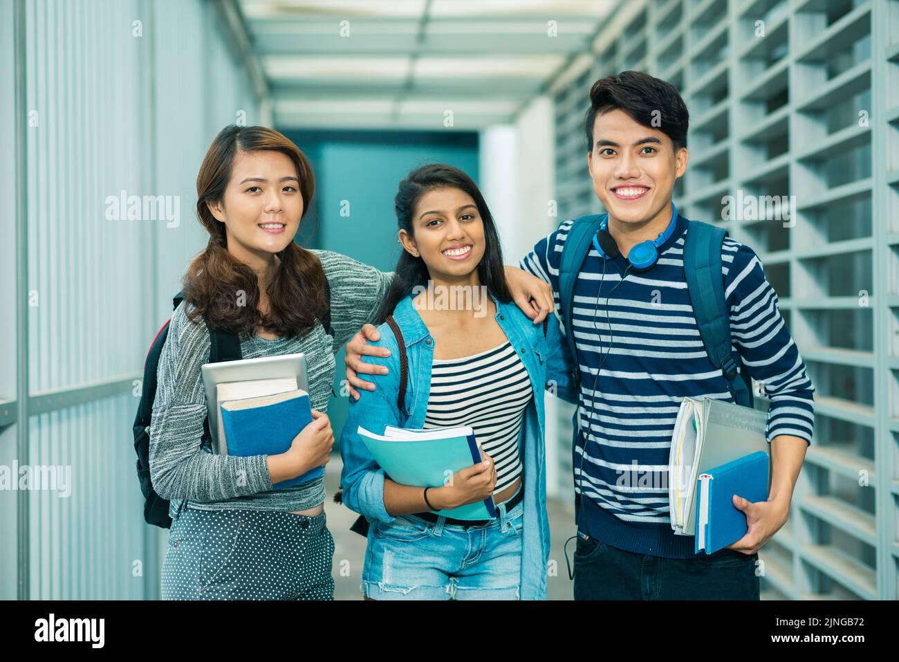 Group of happy college students with books and textbooks Stock Photo