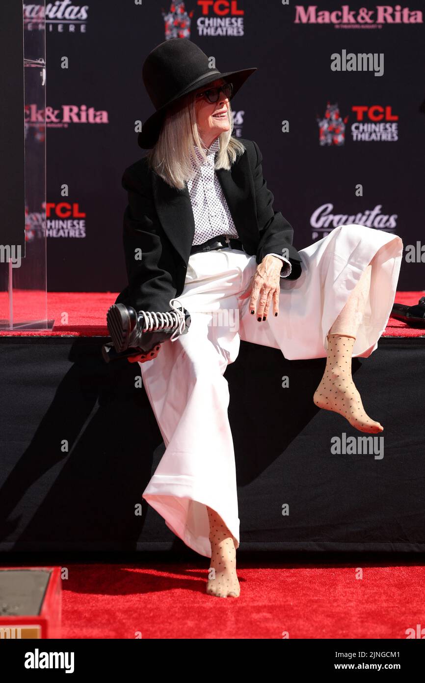 Actor Diane Keaton takes off her shoes before making her footprints in cement during a ceremony TCL Chinese theatre in Los Angeles, California, U.S., August 11, 2022. REUTERS/Mario Anzuoni Stock Photo