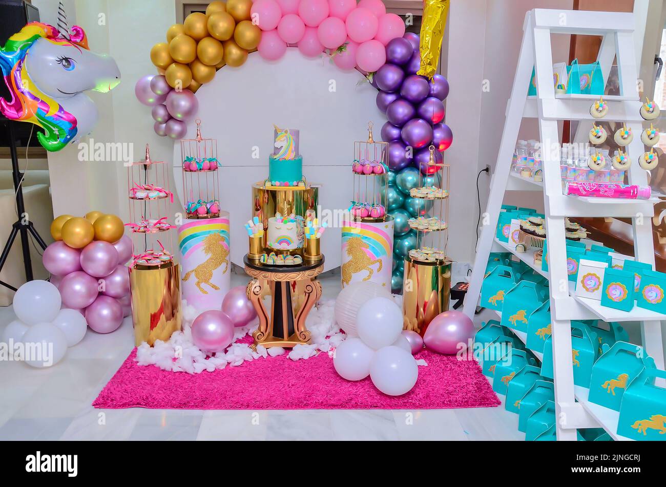 Birthday Buffet with Unicorn Cake. Birthday Girl Stock Photo