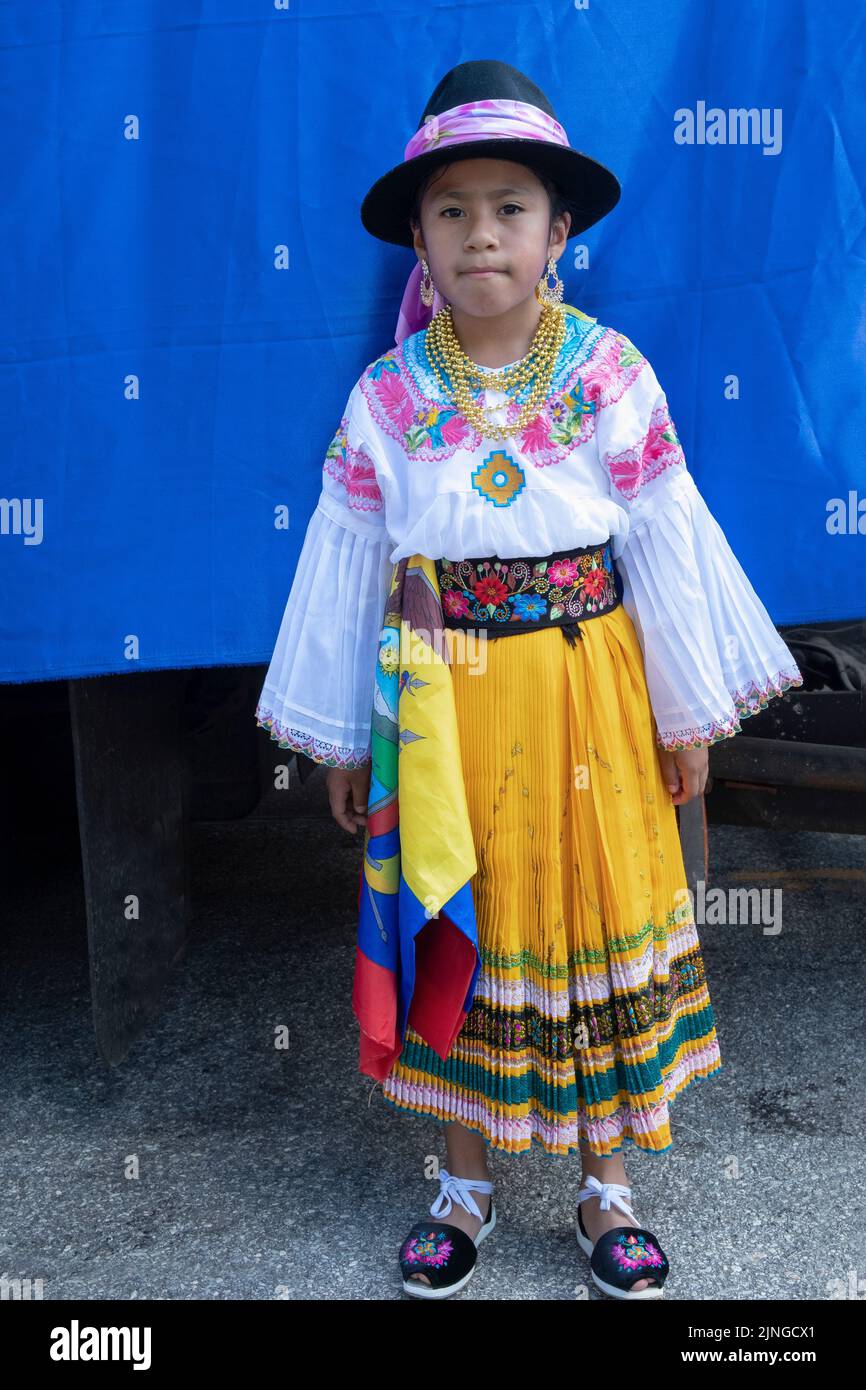 A very cute young Ecuadorian American in traditional clothes girl poses for a photo before the Ecuador Parade NYC 2022 in Jackson Heights, Queens, New. Stock Photo