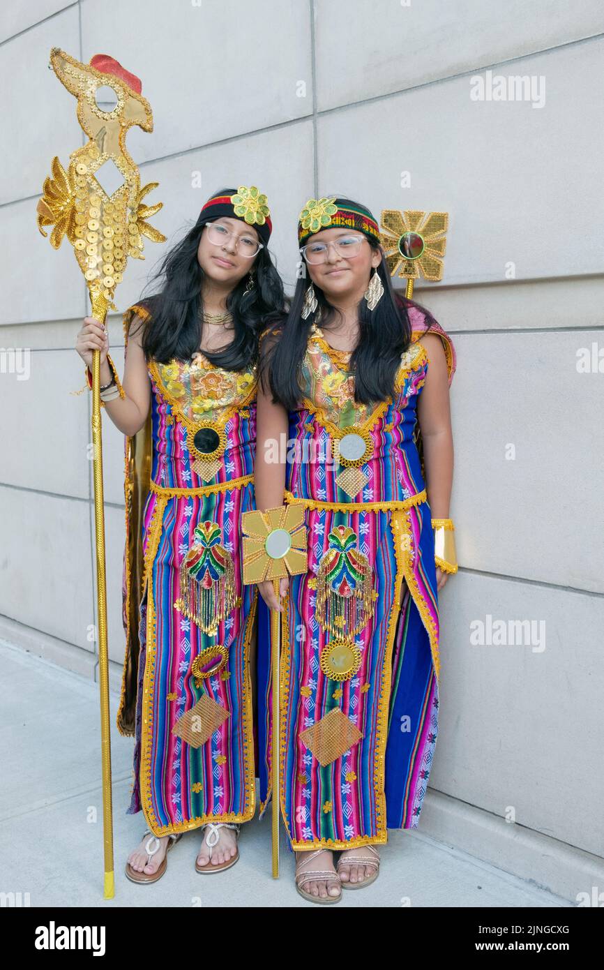 2 teenagers in traditional clothing from the Cuenca Quechua area of Southern Ecuador at the the Ecuadorian Parade NYC 2022 in Jackson Heights, Queens,. Stock Photo