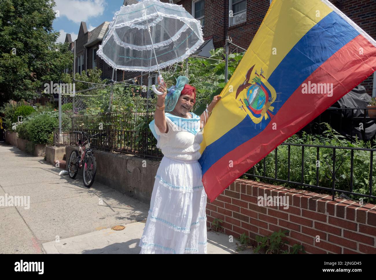 Posed portrait of an attractive red haired Ecuadorian American woman in her 70s at the Ecuadorian Parade NYC 2022 in Jackson Heights, Queens, New York Stock Photo