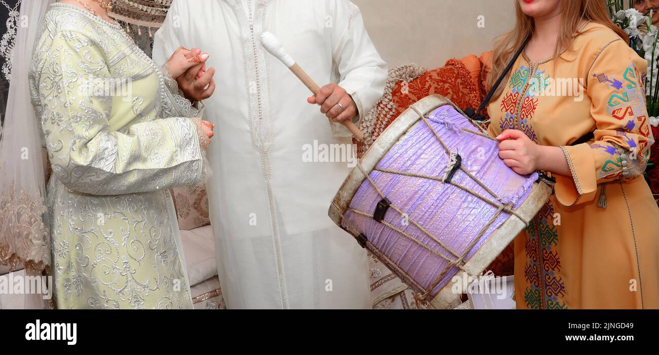 Moroccan bride and groom beat the drums Stock Photo