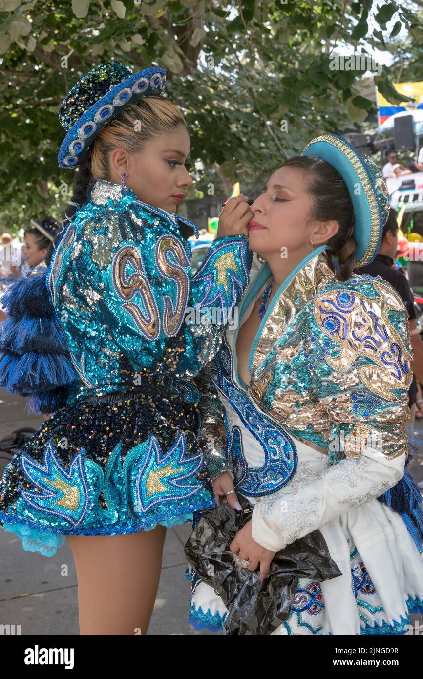 Women dancers from the Caporales San Simon Sucre prepare for the Ecuadorian Parade NYC 2022. In Jackson Heights, Queens, New York City. Stock Photo
