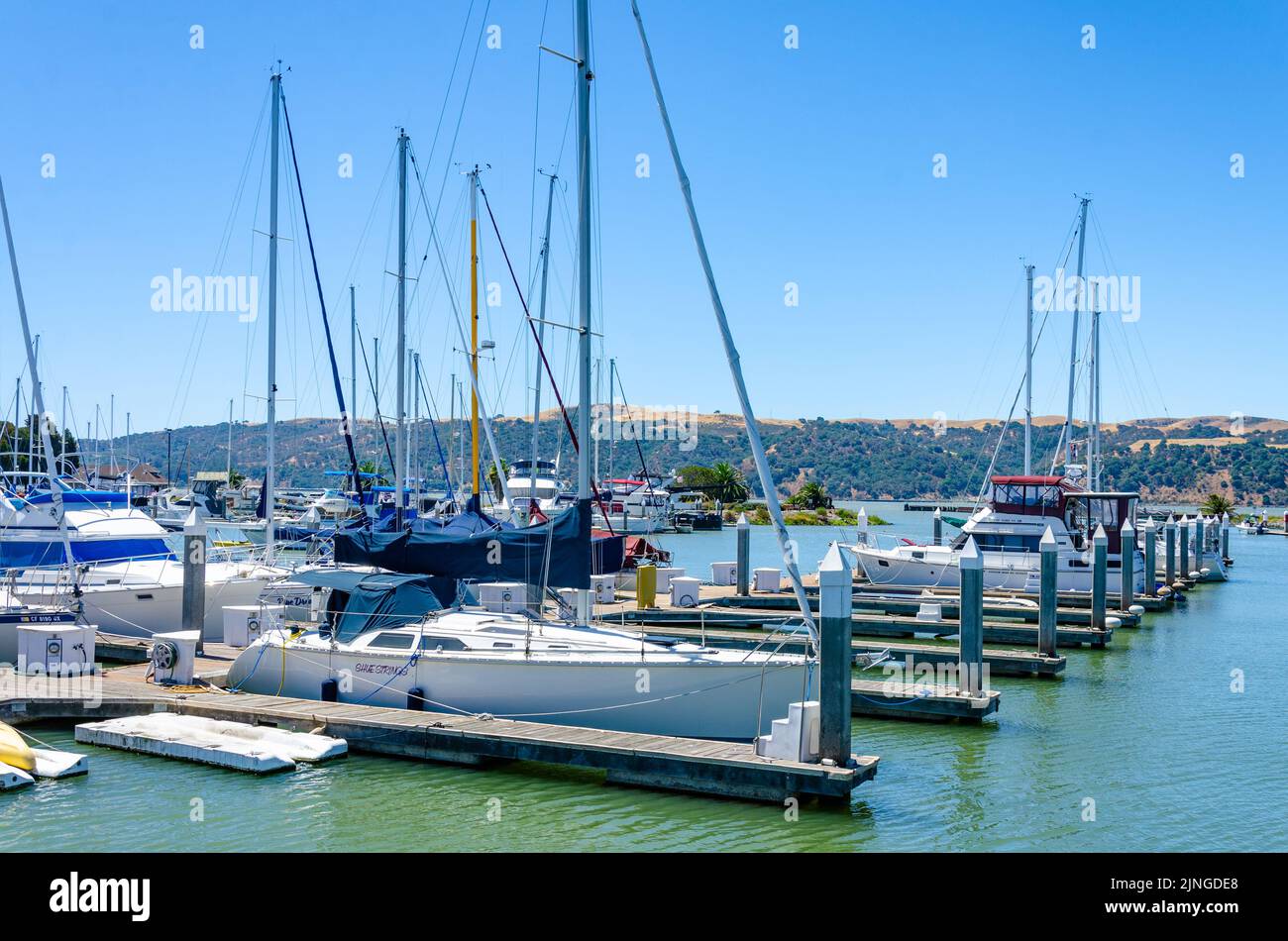 Pleasure boats moored against a pontoon in Benicia Marina in California, USA Stock Photo