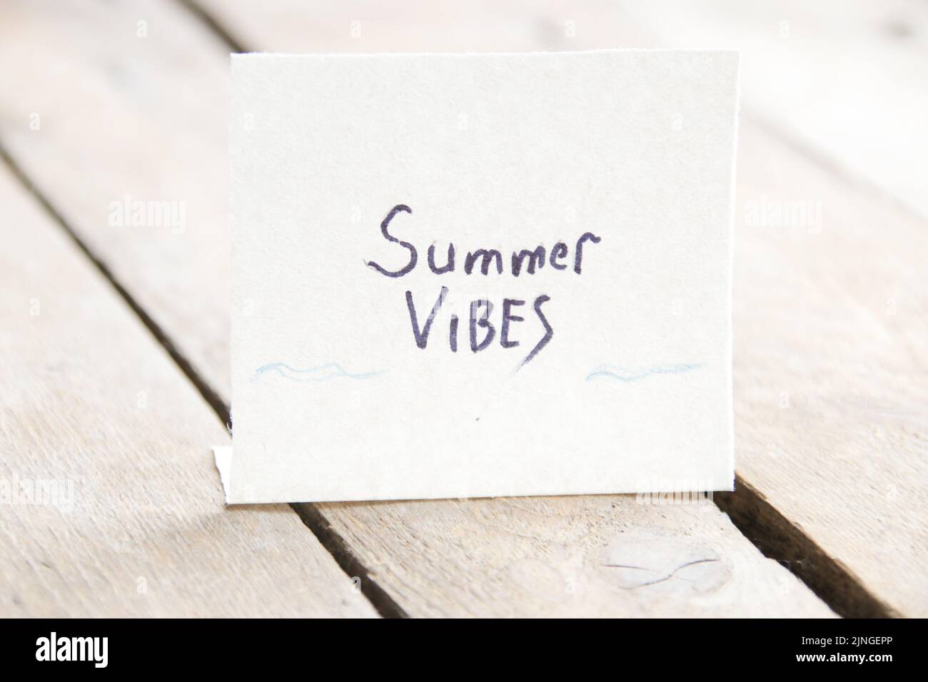 The inscription on a piece of paper summer vibe Stock Photo - Alamy