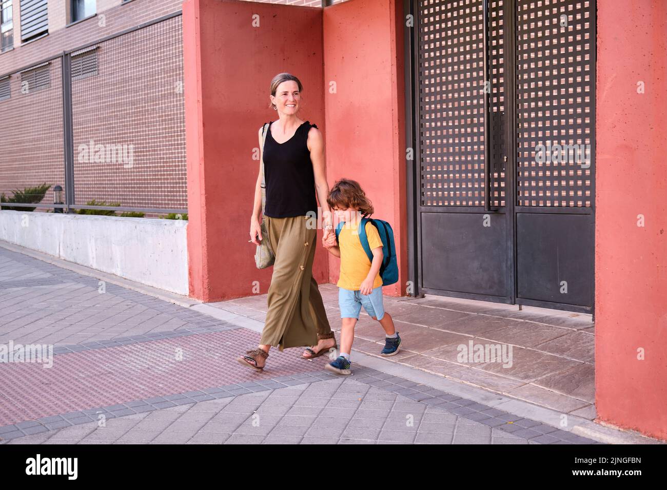 Students Walking In Line Hands Behind Back