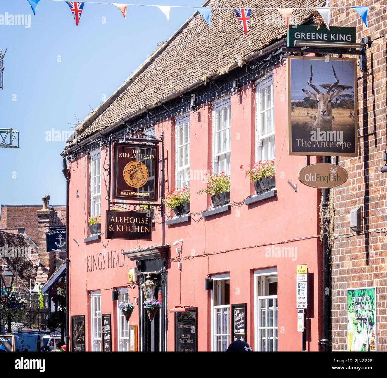 Three different pub signs in a row, for three different breweries, in Poole, Dorset, UK on 11 August 2022 Stock Photo