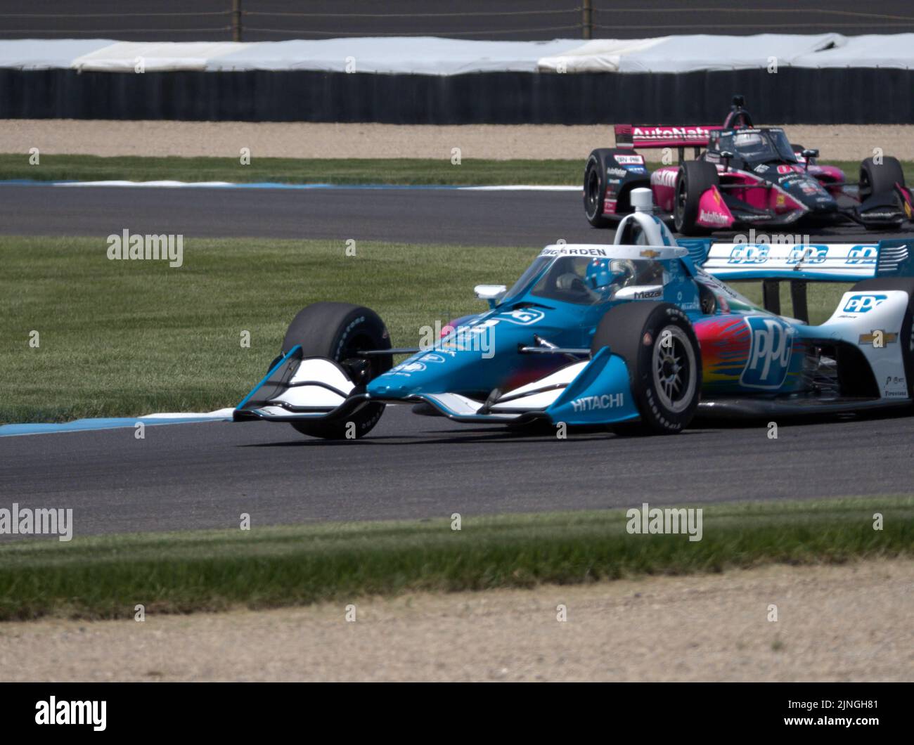 A view of racing cars on the road during Qualifying for the Indianapolis Grand Prix Stock Photo