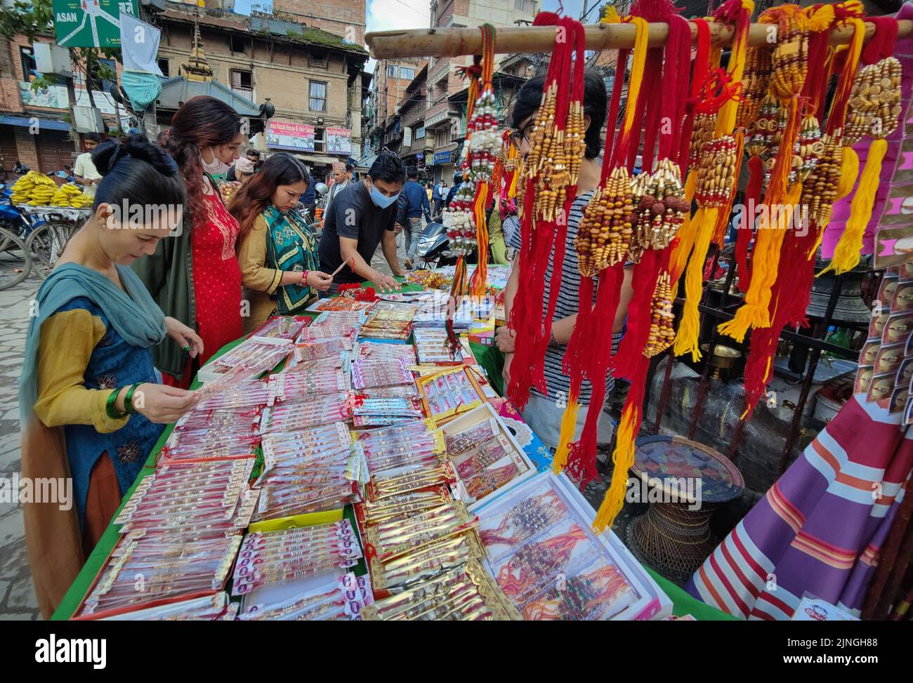 Kathmandu, Bagmati, Nepal. 11th Aug, 2022. Nepali women select sacred