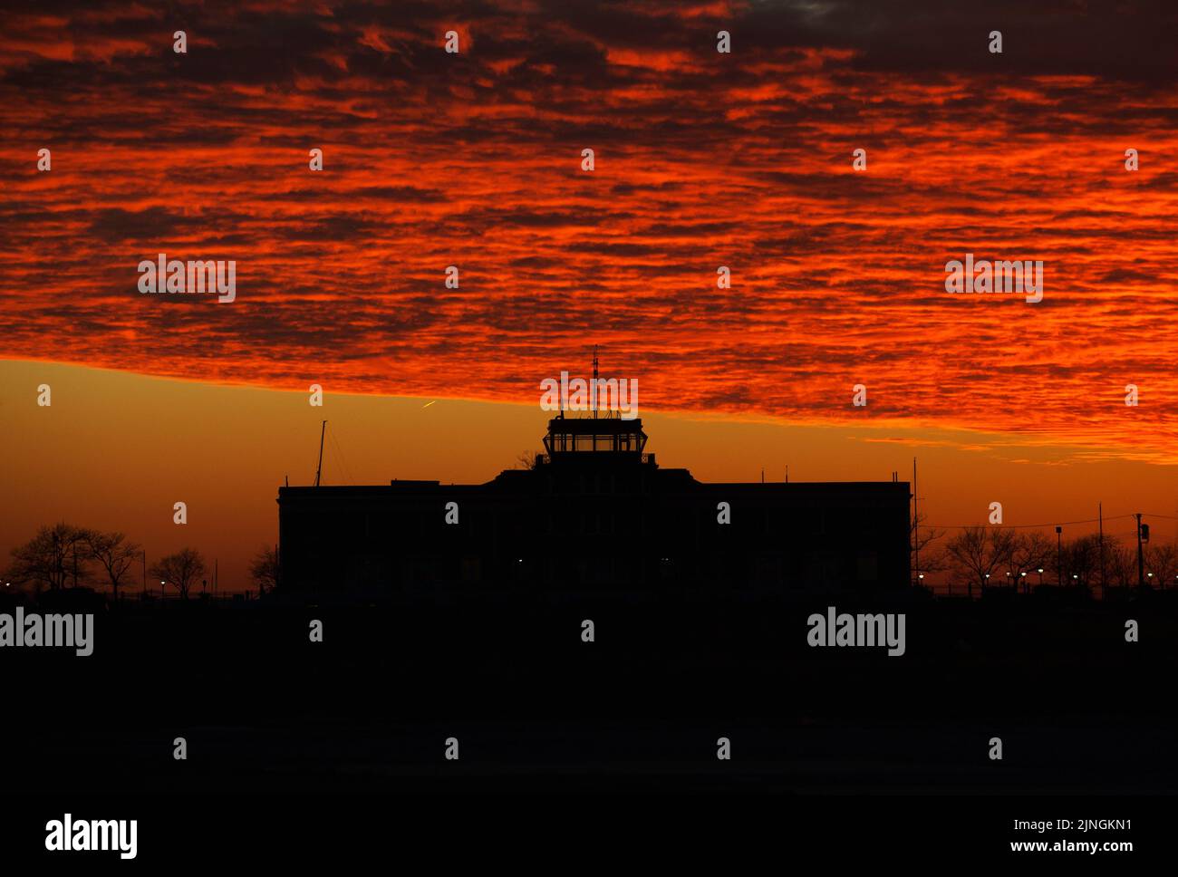 Ryan visitor center at Floyd Bennet Field with dramatic sunset clouds, Stock Photo