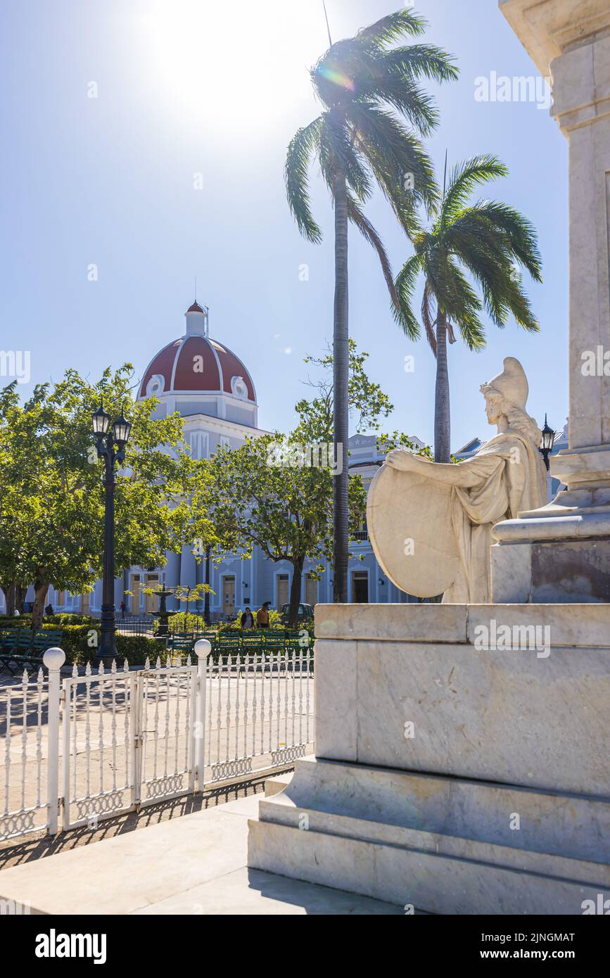 CIENGUEGOS, CUBA - JANUARY 10 2021: Cienfuegos Jose Marti central park with palms and historical buildings, Cienfuegos Province, Cuba Stock Photo