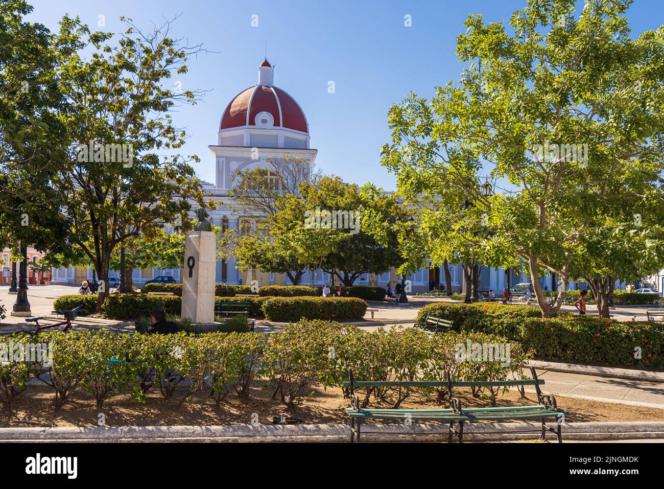 CIENGUEGOS, CUBA - JANUARY 10 2021: Cienfuegos Jose Marti central park with palms and historical buildings, Cienfuegos Province, Cuba Stock Photo