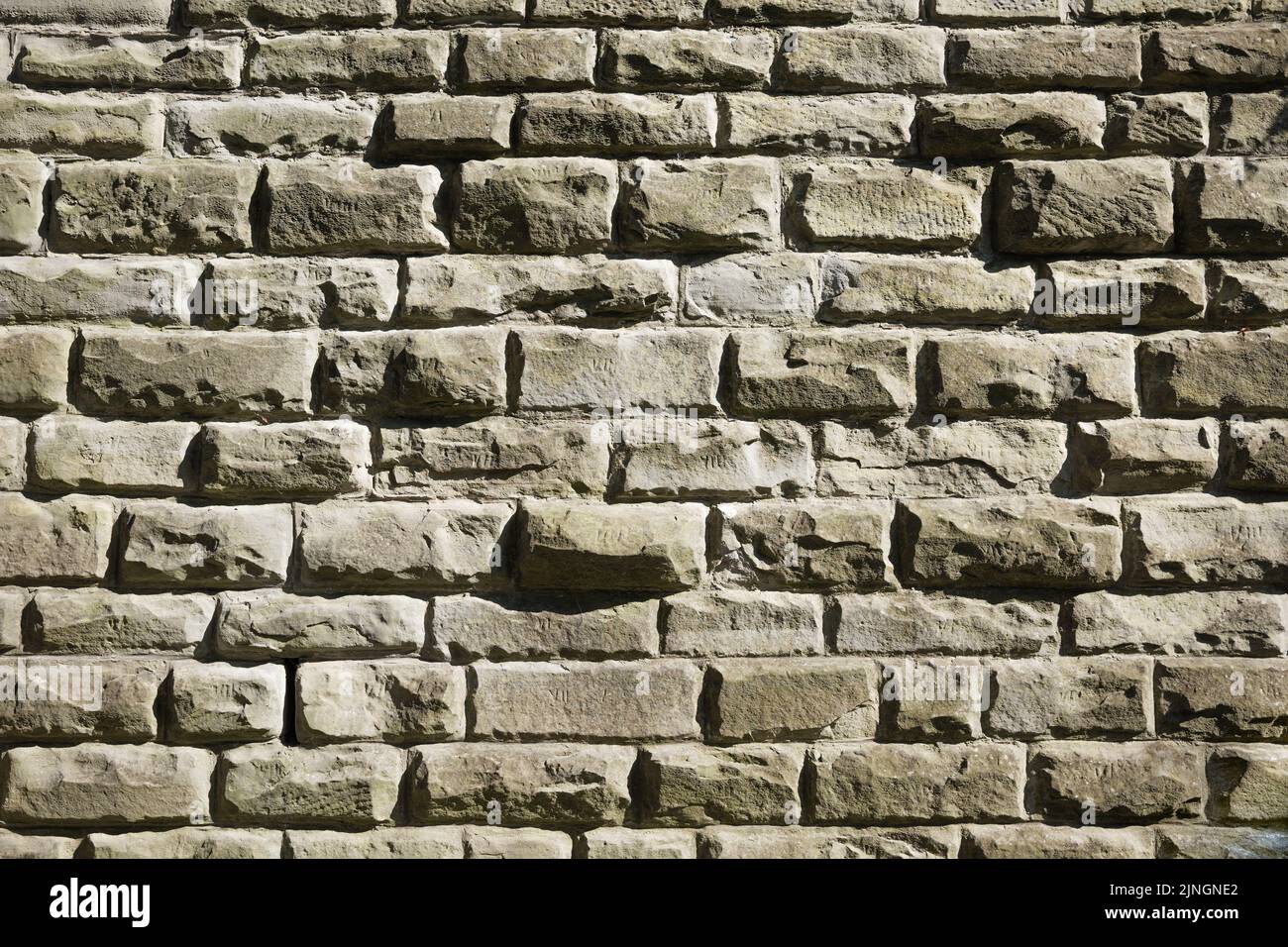 A closeup shot of a part of an old medieval stone wall Stock Photo - Alamy