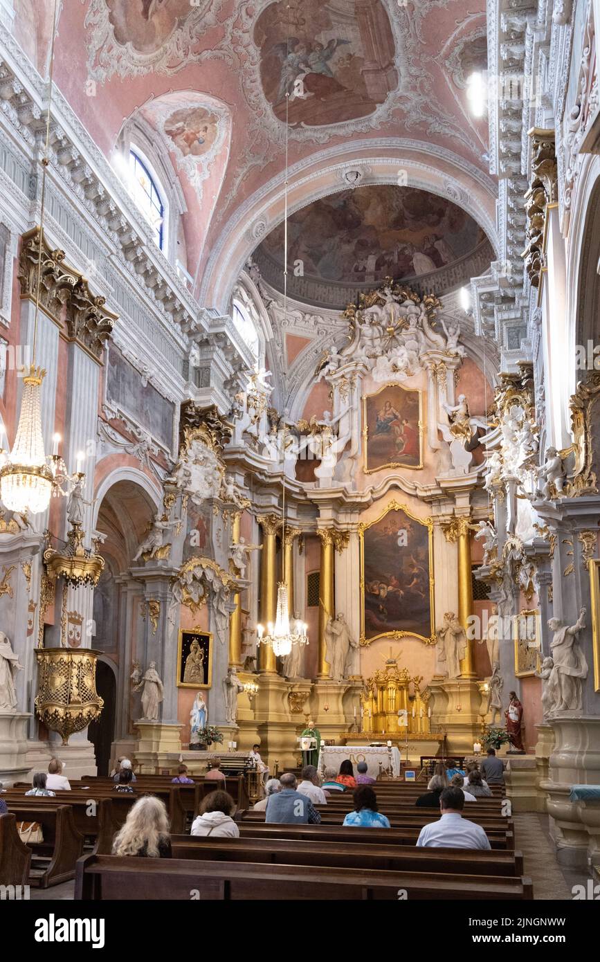 Vilnius Cathedral (Cathedral Basilica of St Stanislaus and St Ladislaus of Vilnius), interior, Catholic congregation in the nave, Vilnius, Lithuania Stock Photo