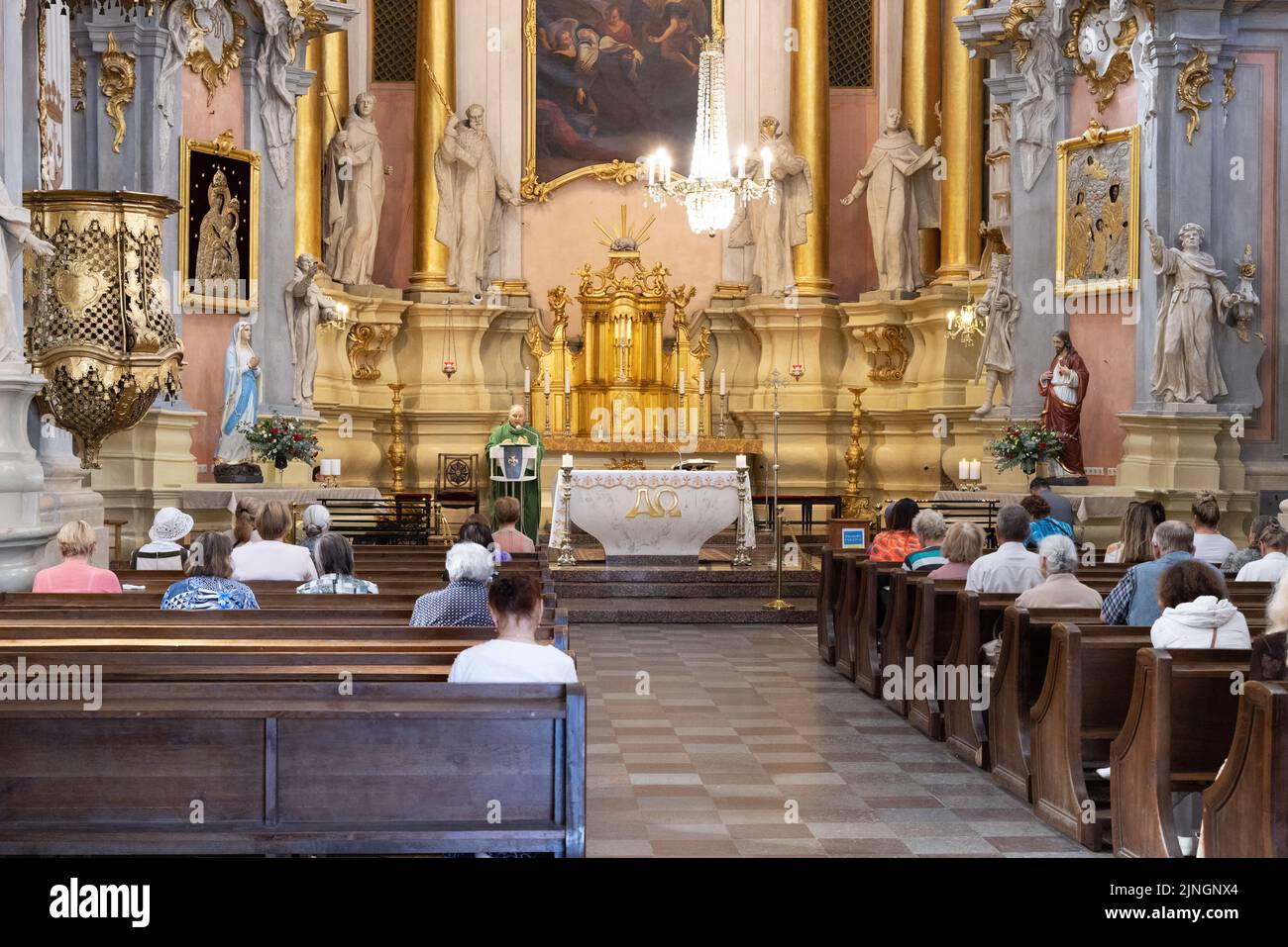 Vilnius Cathedral (Cathedral Basilica of St Stanislaus and St Ladislaus of Vilnius), interior, Catholic congregation in the nave, Vilnius, Lithuania Stock Photo