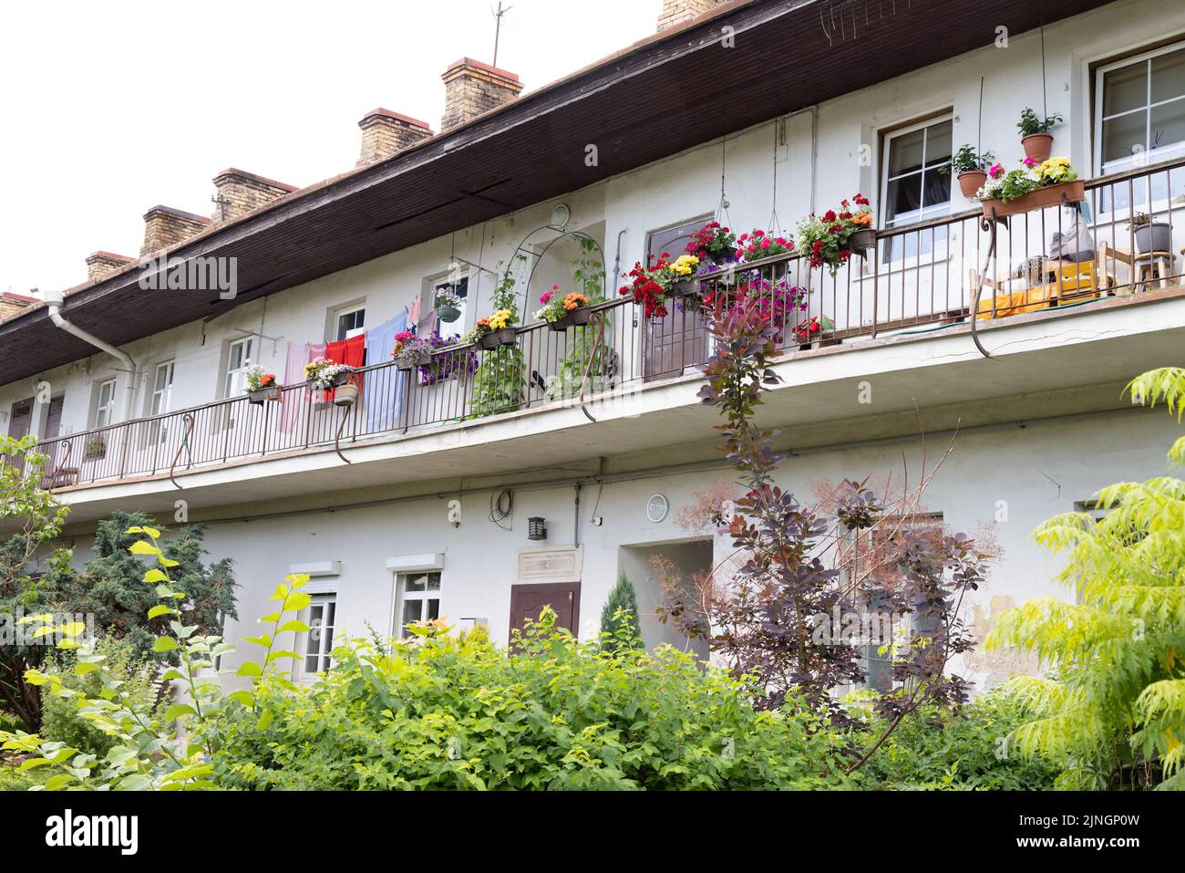 Vilnius housing accommodation; flats in Vilnius old town with flower boxes outside in summer, example of Lithuania lifestyle; Vilnius Lithuania europe Stock Photo