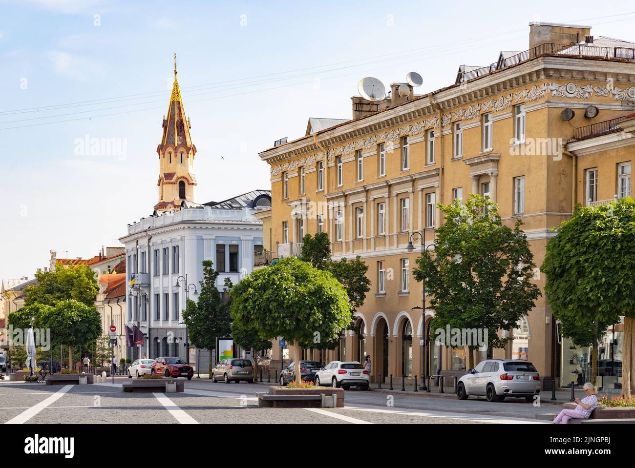 Vilnius street scene of Vilnius old town, from Town Hall Square looking to St Nicholas Church in summer sunshine, Vilnius Lithuania, Europe Stock Photo