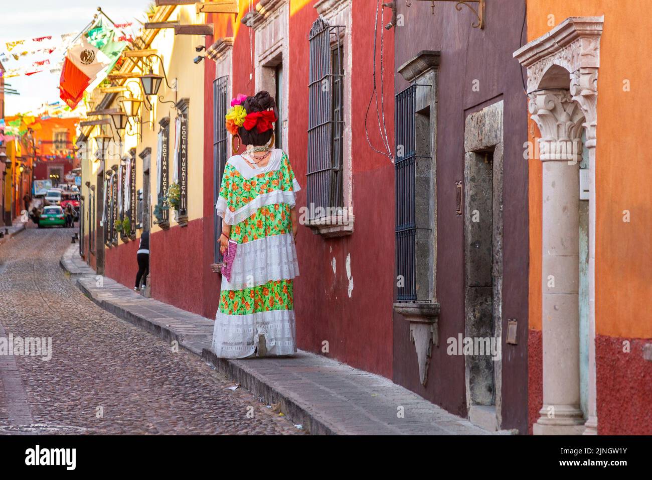 A mojiganga, or giant puppet made from papier mâché as it walks through the historic city center of San Miguel de Allende, Mexico. Stock Photo