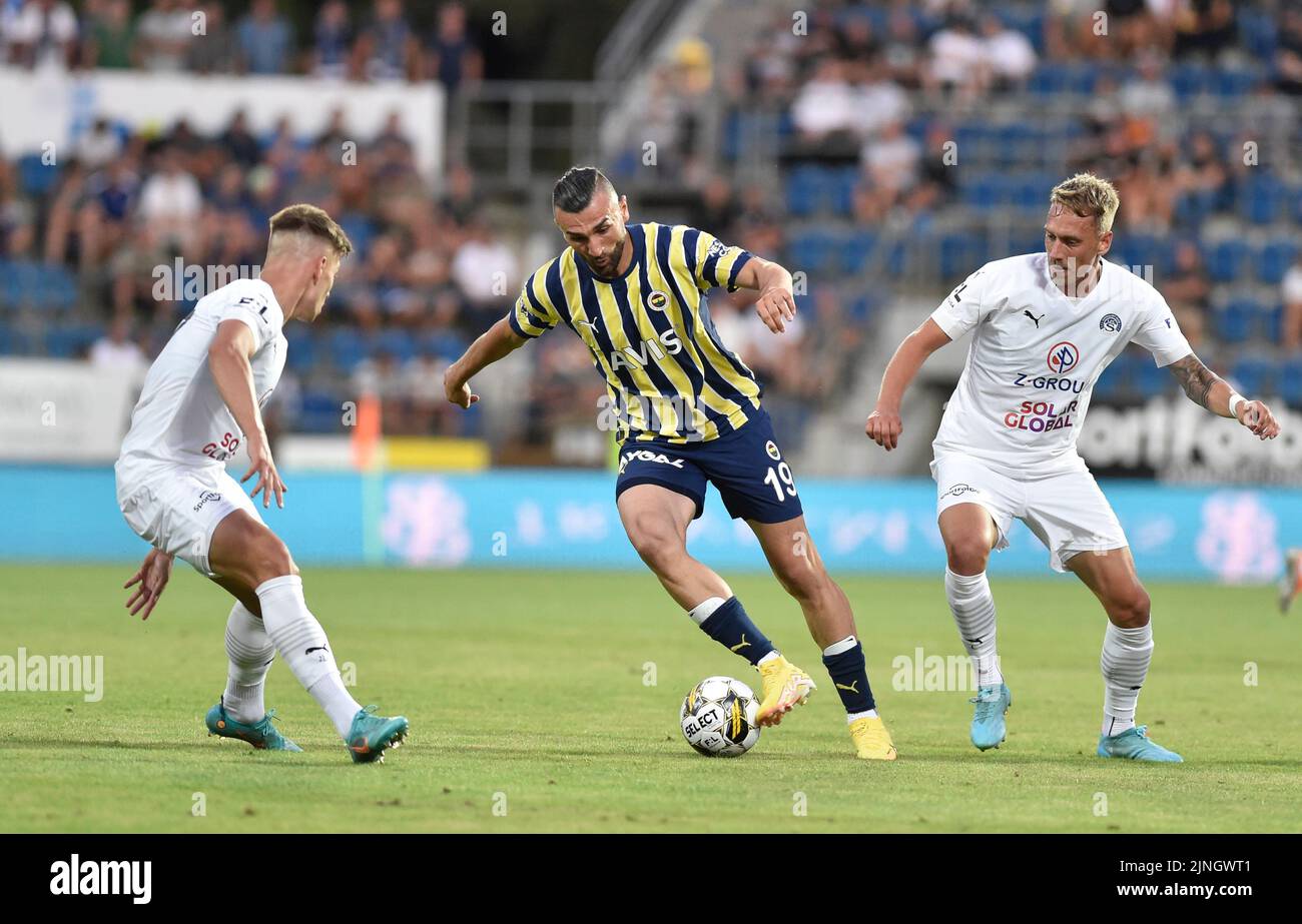 Uherske Hradiste, Czech Republic. 11th Aug, 2022. From left Michal Tomic of Slovacko and Serdar Dursun of Fenerbahce and Patrik Simko of Slovacko in action during the European Football League third qualifying round return match: FC Slovacko vs Fenerbahce Istanbul in Uherske Hradiste, Czech Republic, August 11, 2022. Credit: Dalibor Gluck/CTK Photo/Alamy Live News Stock Photo