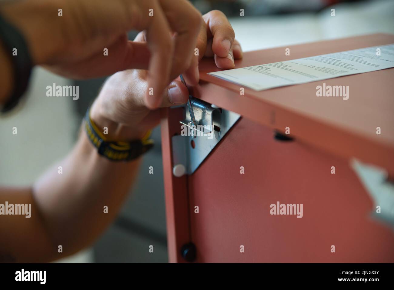 Carpentry Assembly Carpenter working carefully assembling a piece of furniture Stock Photo ...