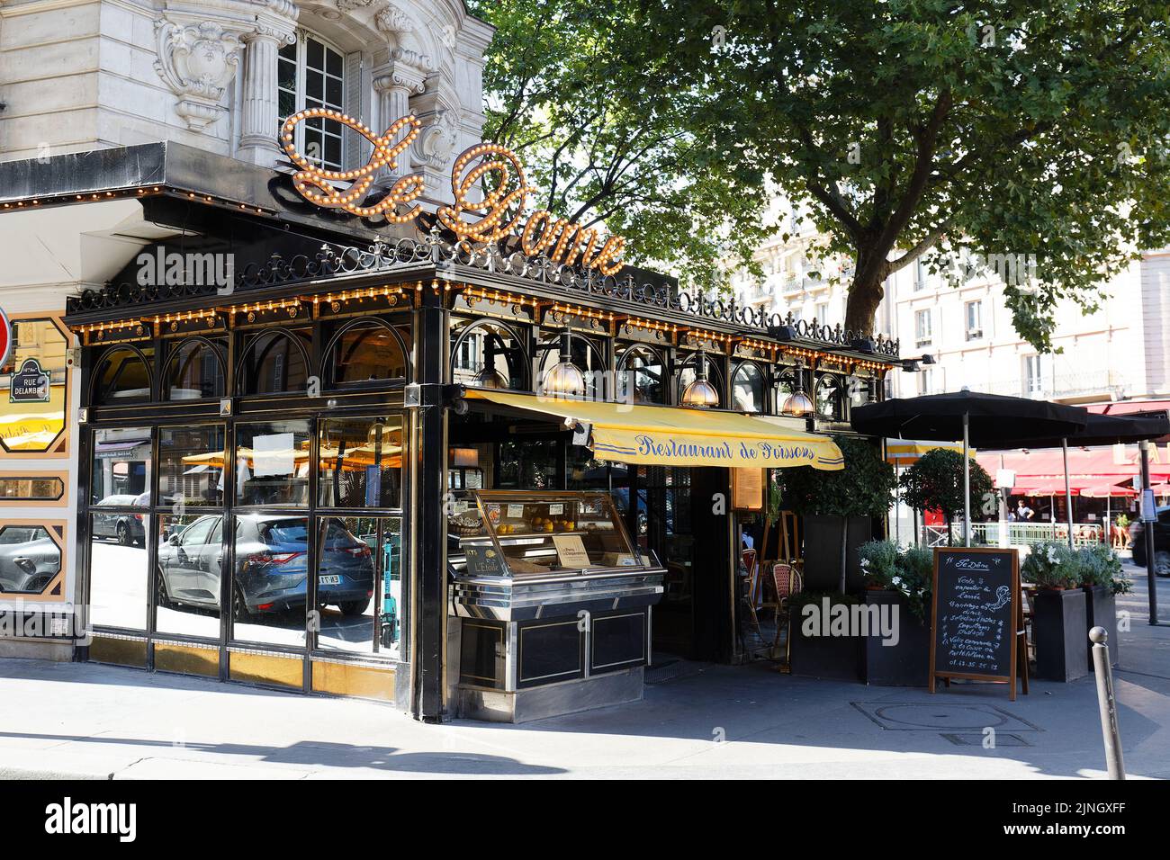 The famous restaurant Le Dome on Montparnasse boulevard in Paris. Opened in 1898 it was frequented by famous sculptors, writers and painters... Stock Photo