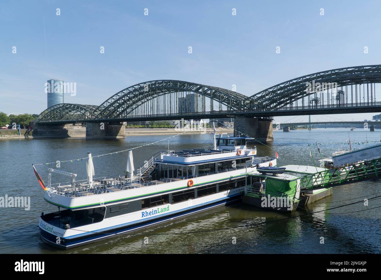 Cologne, Germany, 11 August 2022: The river Rhine is at unusually low levels with lots of bare bank exposed due to the drought and heatwave affecting much of Western Europe. Tourist boats are able to manage well but larger ships carrying, for instance salt from Heilbronn to Cologne, are reducing their loads from their usual 2,200 metric tons to 600 tons so they float higher and avoid grounding in the shallow water. The German economy is more reliant on inland waterways for transport than other Western European countries. Anna Watson/Alamy Live News Stock Photo