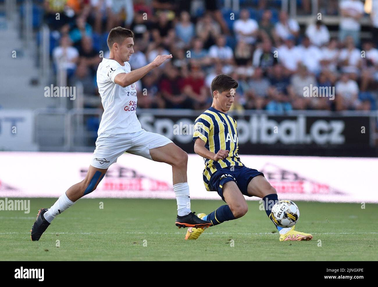 Uherske Hradiste, Czech Republic. 11th Aug, 2022. From left Vladislav Levin of Slovacko and Arda Guler of Fenerbahce in action during the European Football League third qualifying round return match: FC Slovacko vs Fenerbahce Istanbul in Uherske Hradiste, Czech Republic, August 11, 2022. Credit: Dalibor Gluck/CTK Photo/Alamy Live News Stock Photo