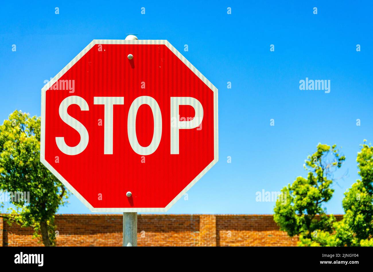 A stop sign at the side of the road in Benicia, California, USA Stock Photo
