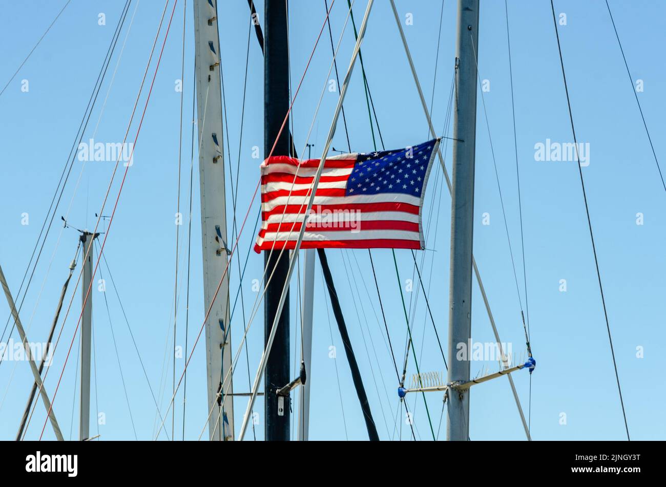The Stars and Stripes, flag of The USA flying from rigging on a boat in Benicia Marin, California Stock Photo