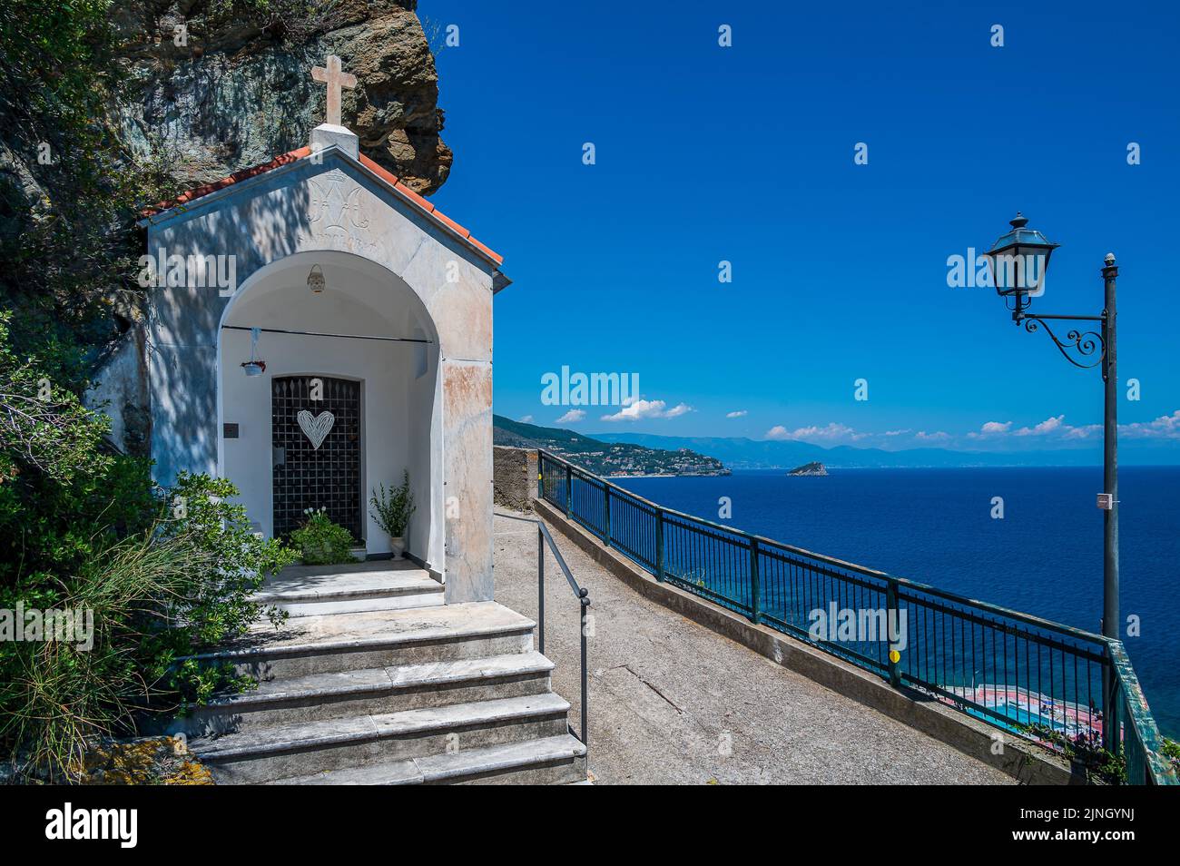 Little white chapel on the trail between Noli and Spotorno, on the italian Riviera Stock Photo