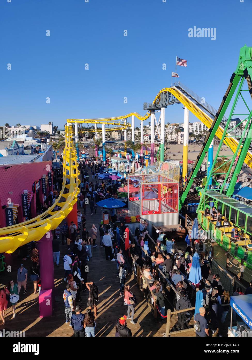 An aerial view of the crowd and the rollercoasters Stock Photo