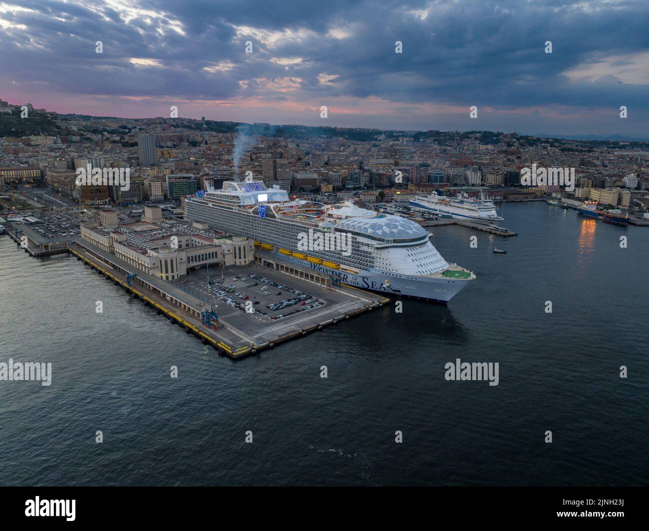 Wonder of the Seas by Royal Caribbean is The biggest cruise ship in the world in Naples port.. Aerial view Stock Photo