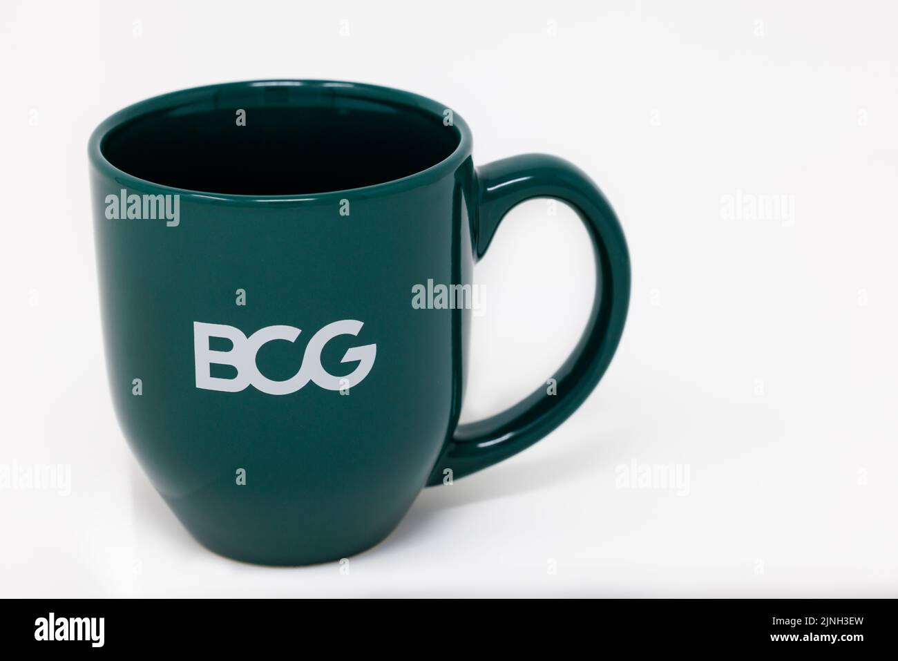 A close-up shot of a Boston Consulting Group green mug Stock Photo